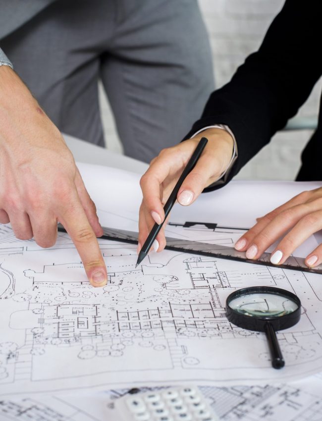 team-members-analyzing-architectural-plan